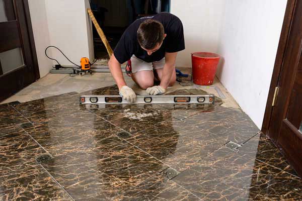 A professional working on tile restoration in Las Vegas, NV